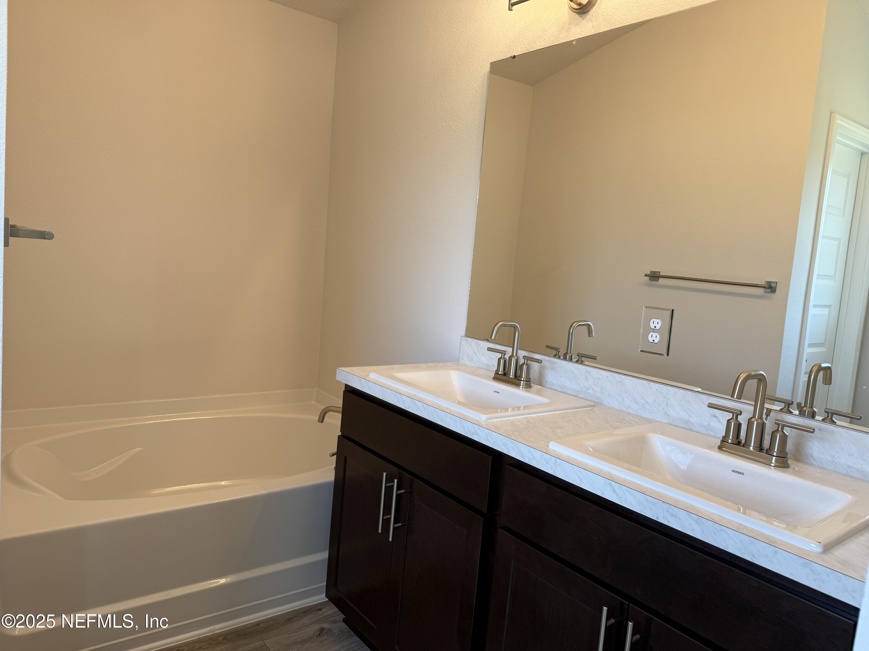 8278 Helmsley Boulevard Jacksonville, FL 32219 - Photo 17 of 27 a bathroom with a sink and a bathtub