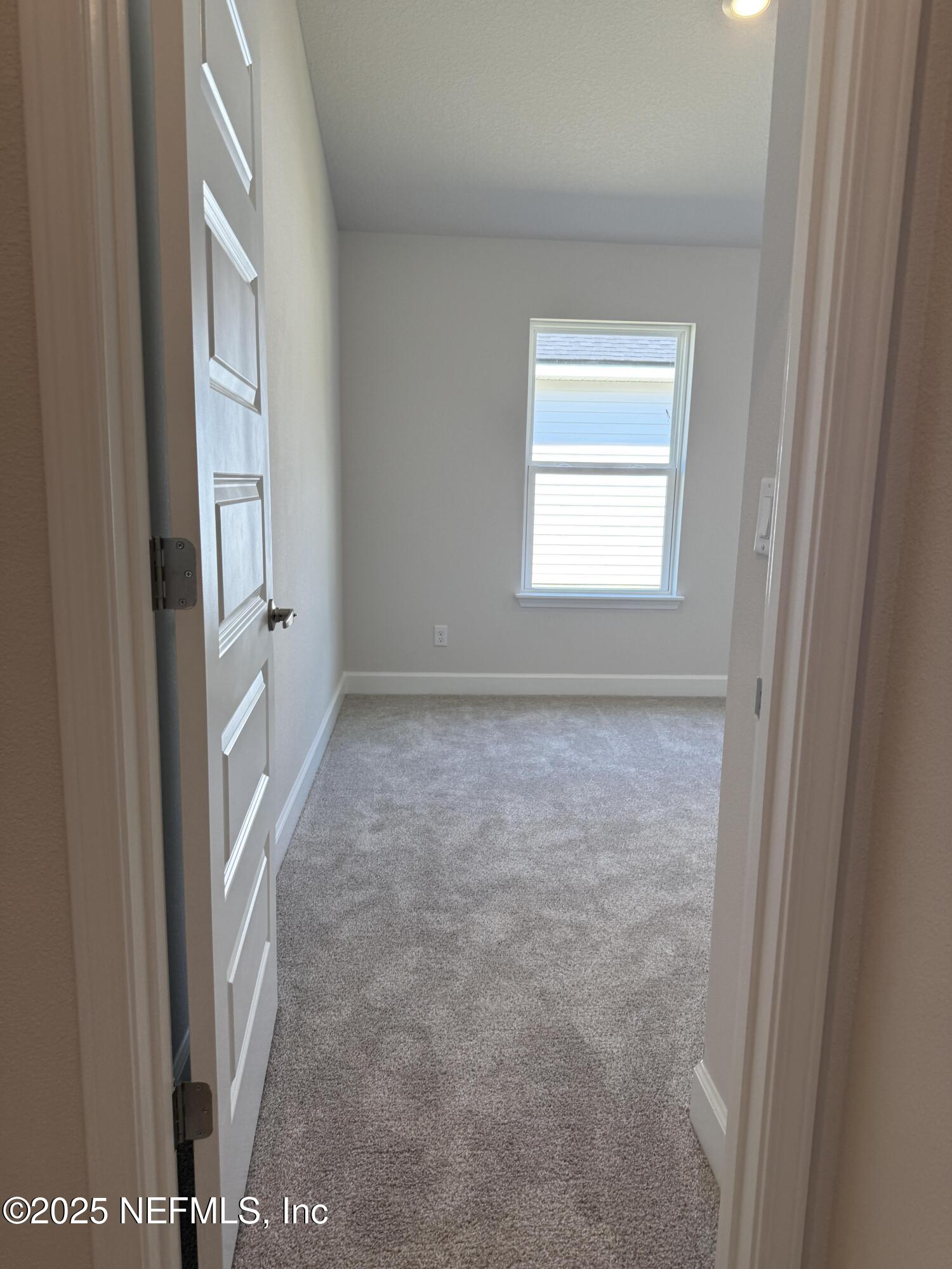 8278 Helmsley Boulevard Jacksonville, FL 32219 - Photo 19 of 27 a view of an empty room with a window