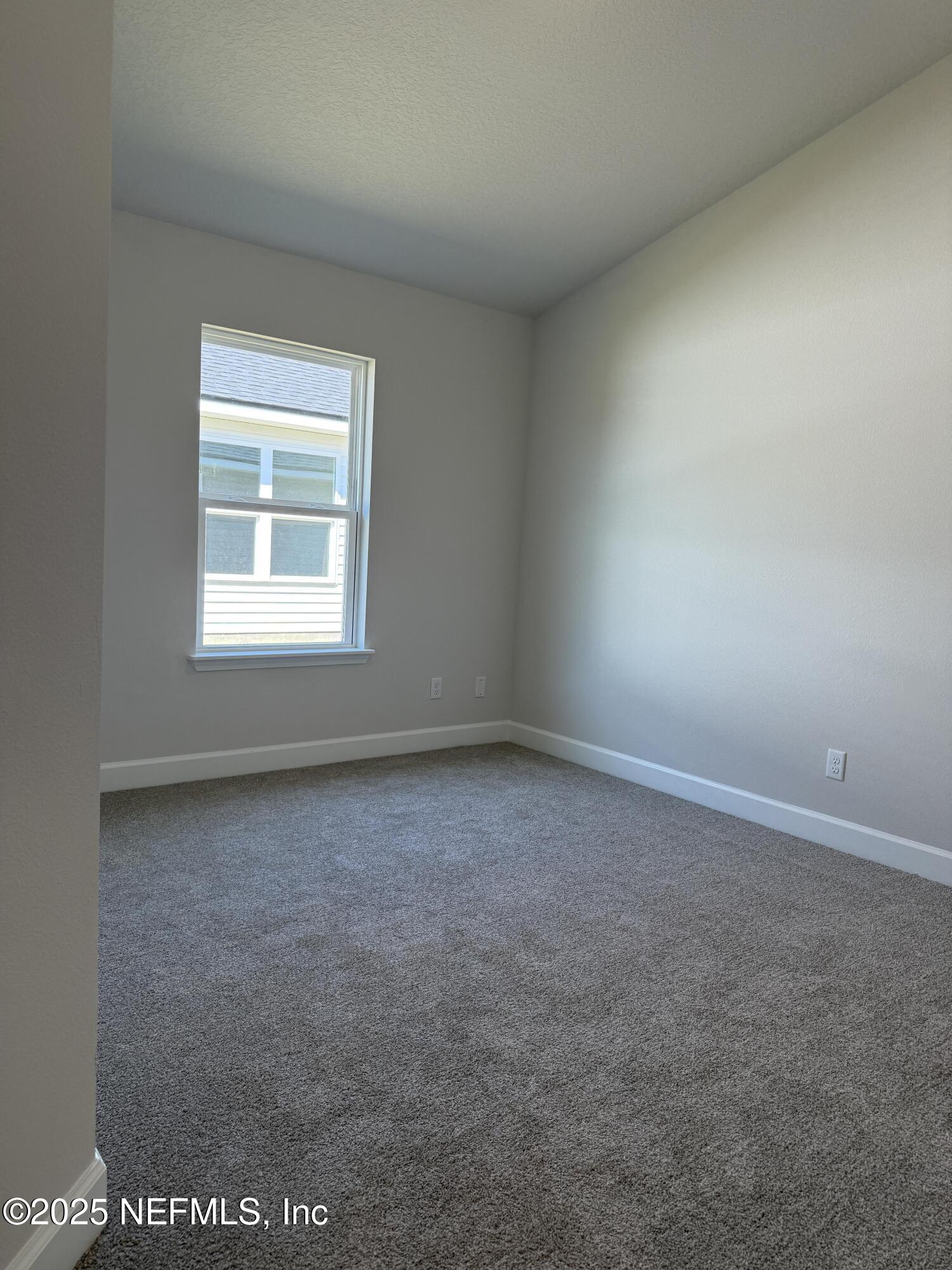 8278 Helmsley Boulevard Jacksonville, FL 32219 - Photo 21 of 27 an empty room with a window