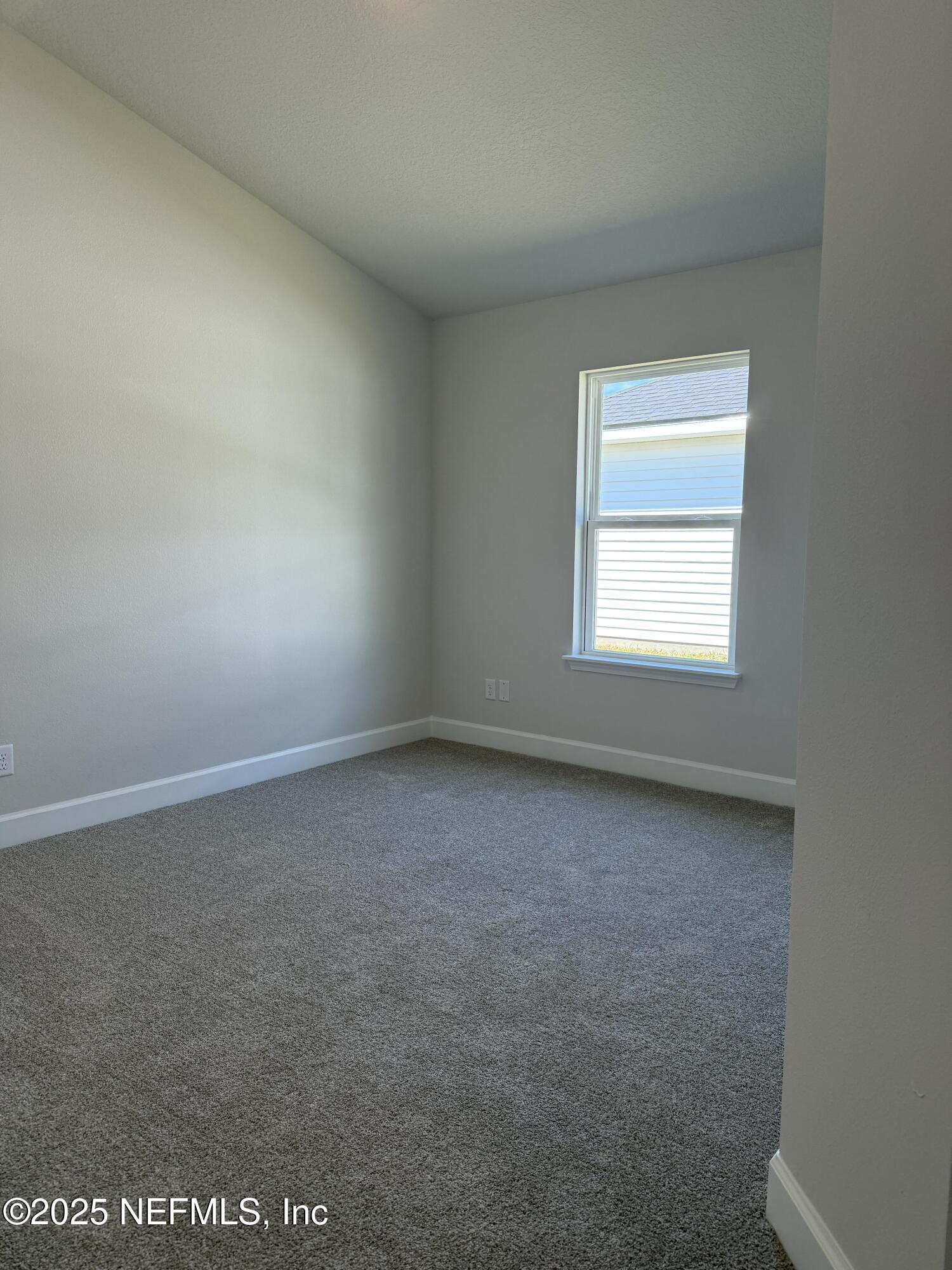 8278 Helmsley Boulevard Jacksonville, FL 32219 - Photo 22 of 27 an empty room with a window