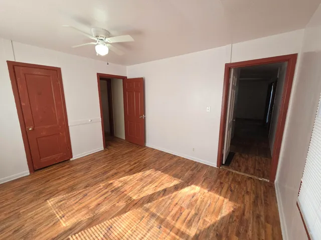a view of a livingroom with wooden floor