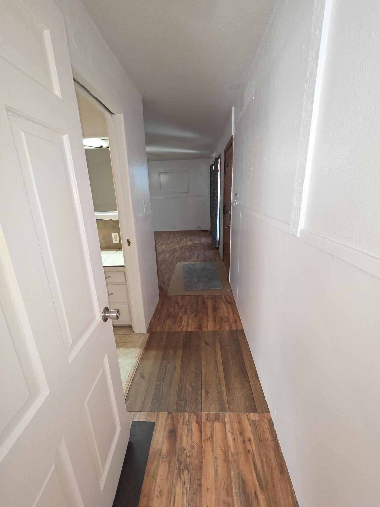 600 Vernon Plainview, TX 79072 - Photo 18 of 30 a view of a hallway view with wooden floor and staircase