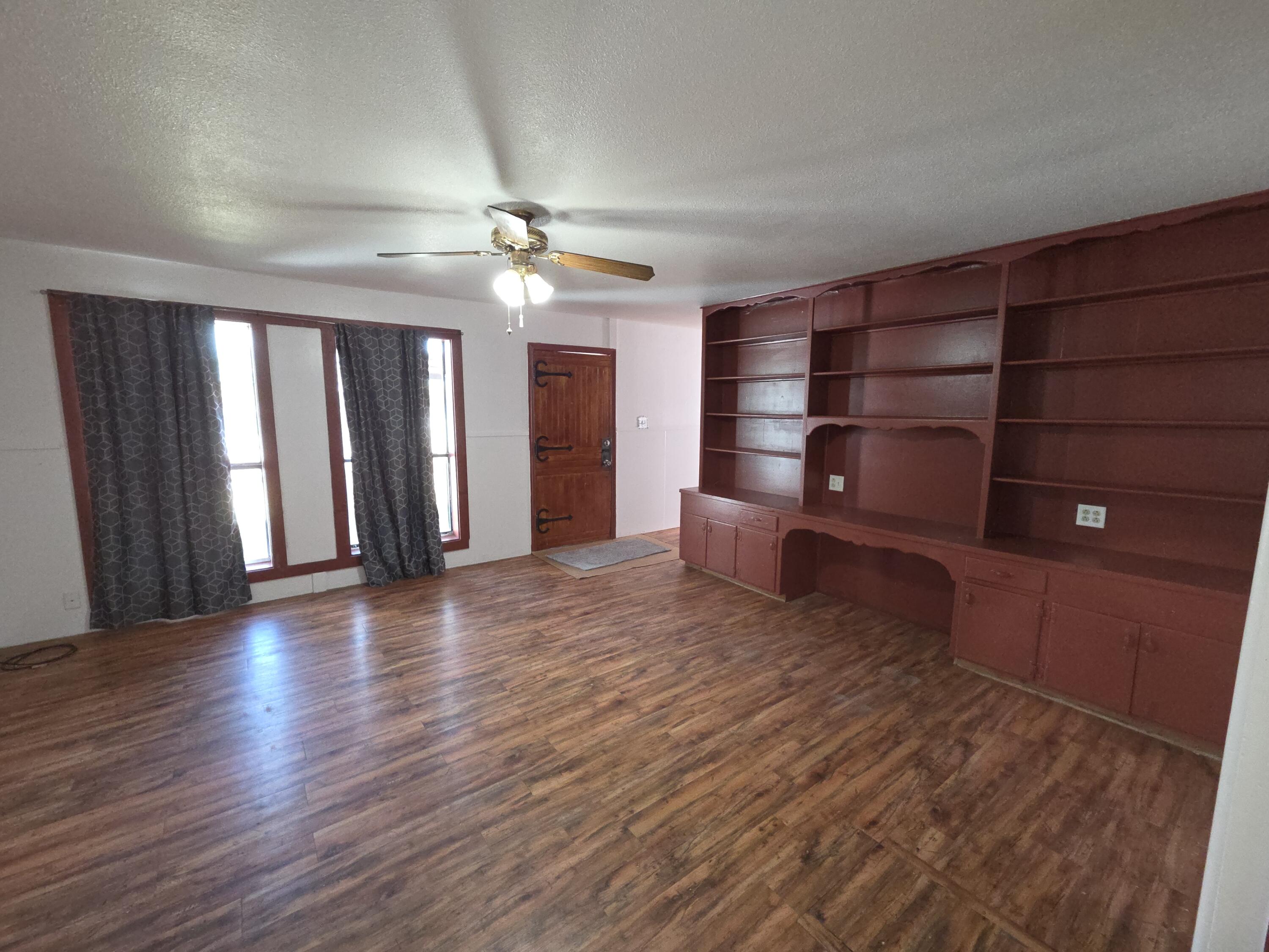 600 Vernon Plainview, TX 79072 - Photo 24 of 30 wooden floor in an empty room with a window