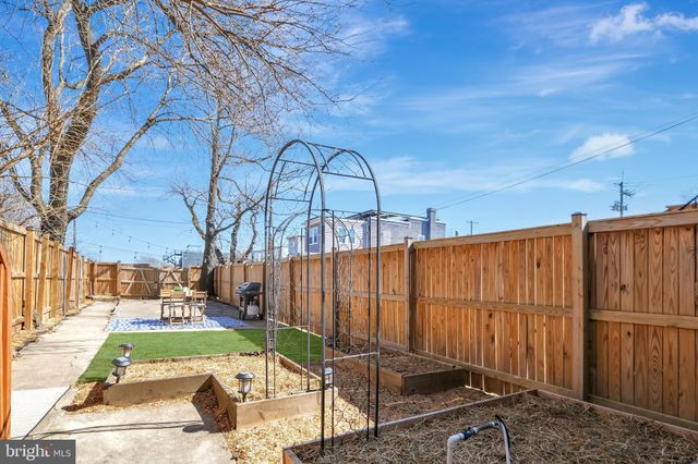 a view of a house with large windows