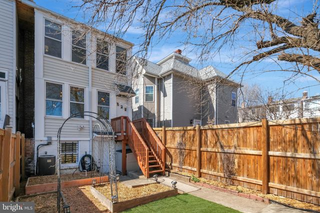 a view of a brick building next to a yard