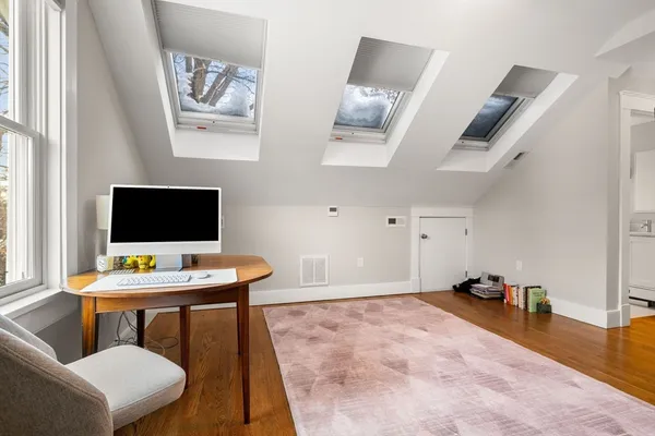 a workspace with furniture and window