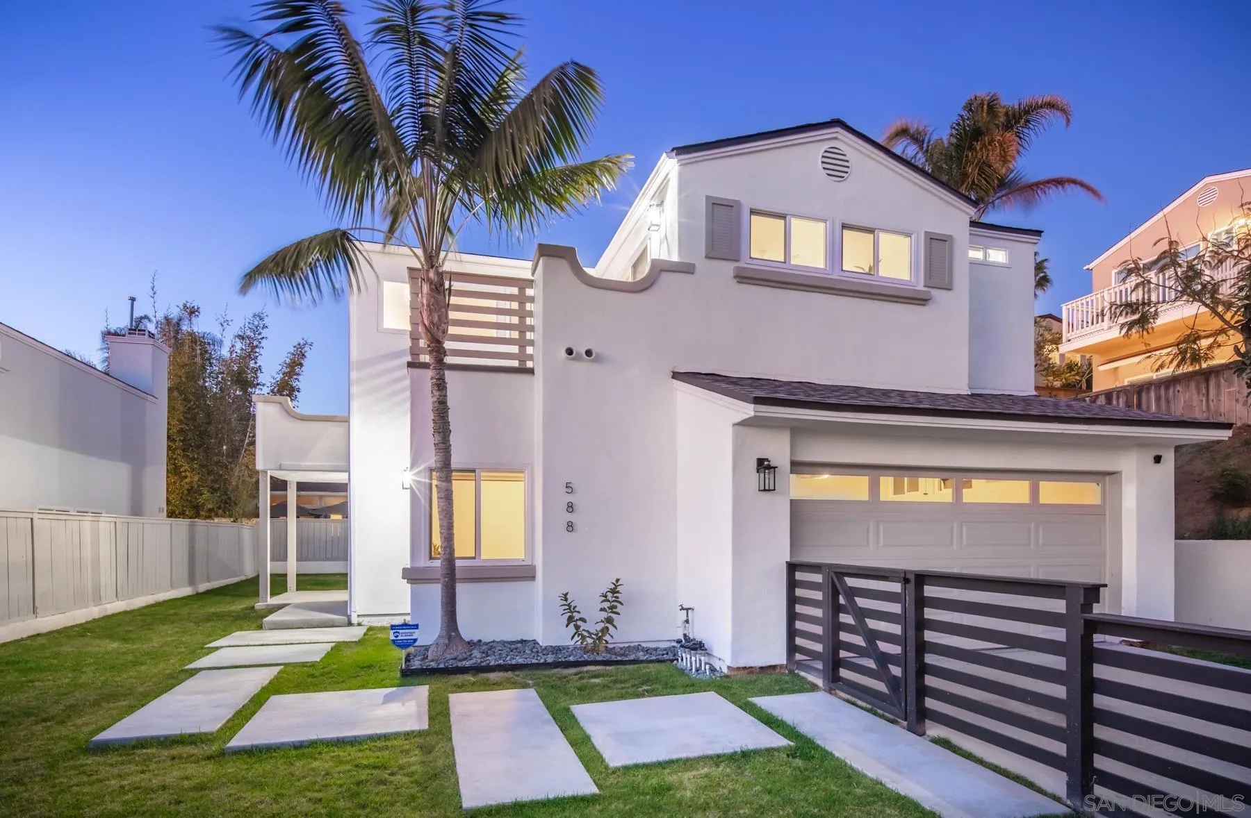 a view of backyard with a patio and a garden