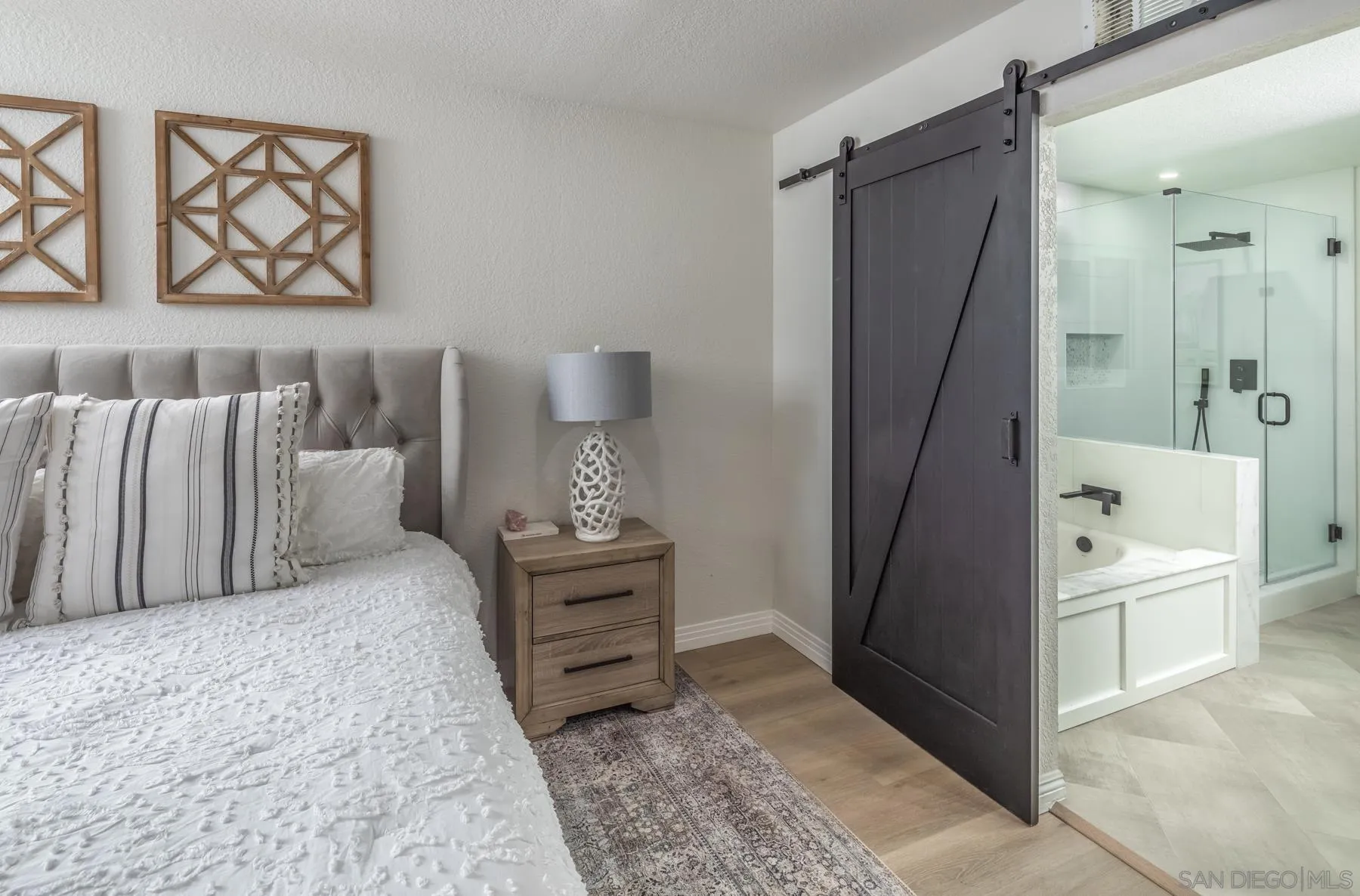 588 Melba Road Encinitas, CA 92024 - Photo 16 of 23 a bedroom with a bed and a walk in closet