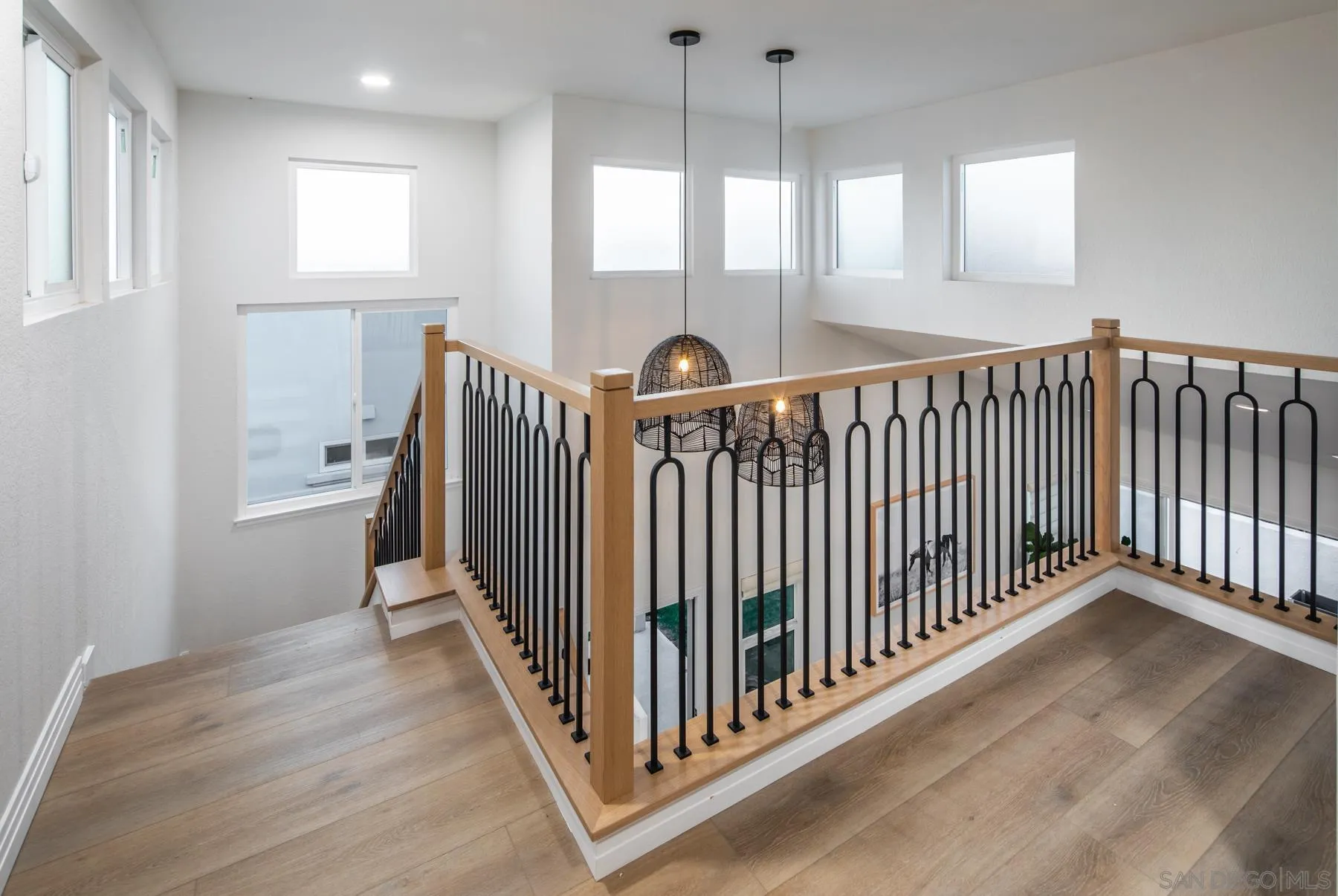 588 Melba Road Encinitas, CA 92024 - Photo 18 of 23 a view of a hallway with windows