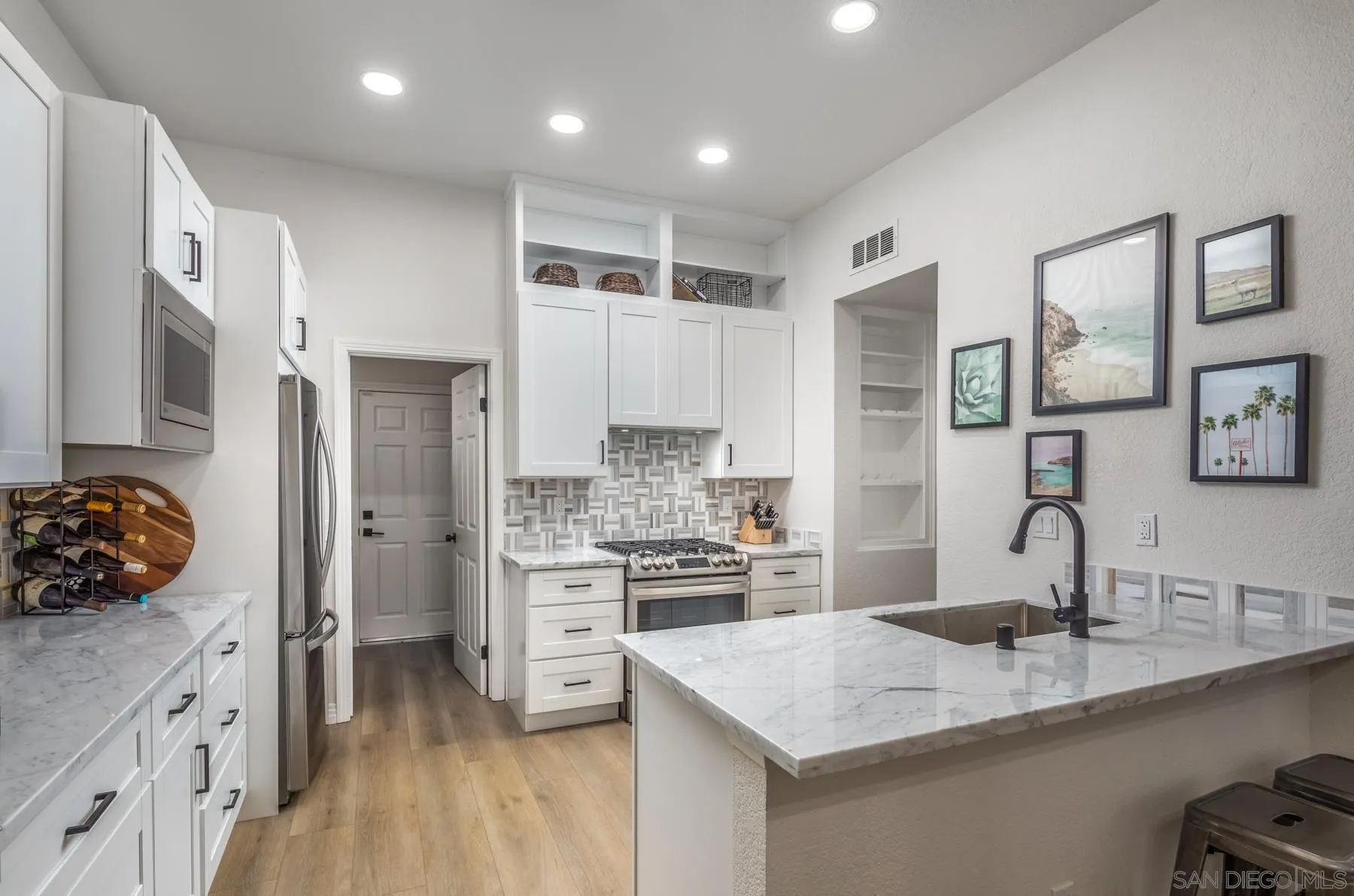 588 Melba Road Encinitas, CA 92024 - Photo 8 of 23 a kitchen with a sink stove and refrigerator