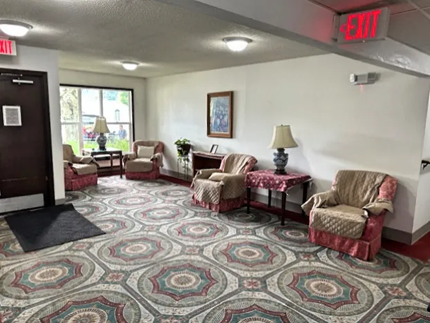 a living room with furniture and a window
