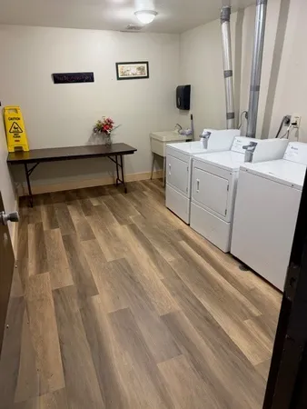 a view of a bathroom with sink and mirror