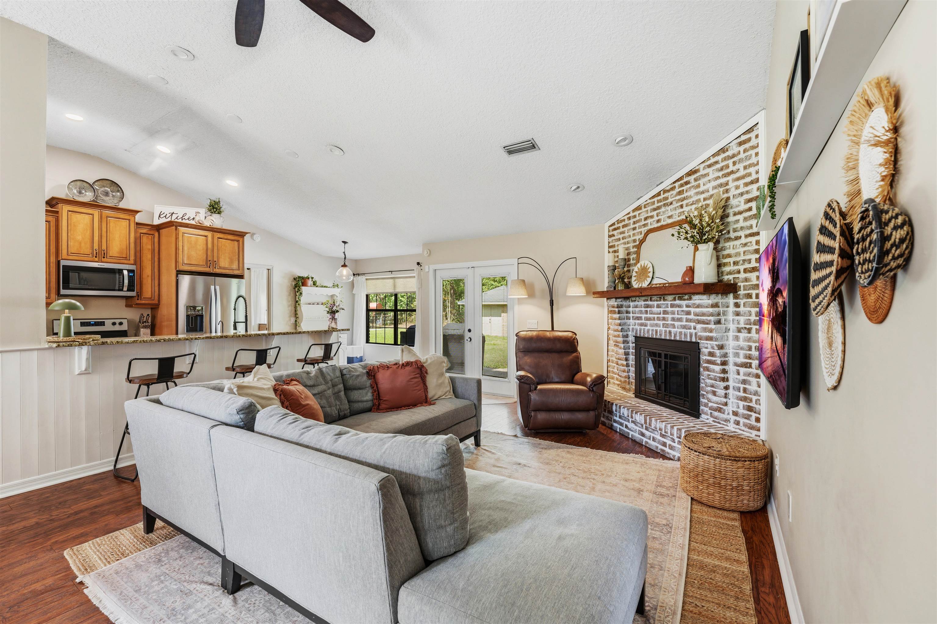 1805 Bennett Road St. Augustine, FL 32092 - Photo 8 of 65 a living room with furniture and a fireplace