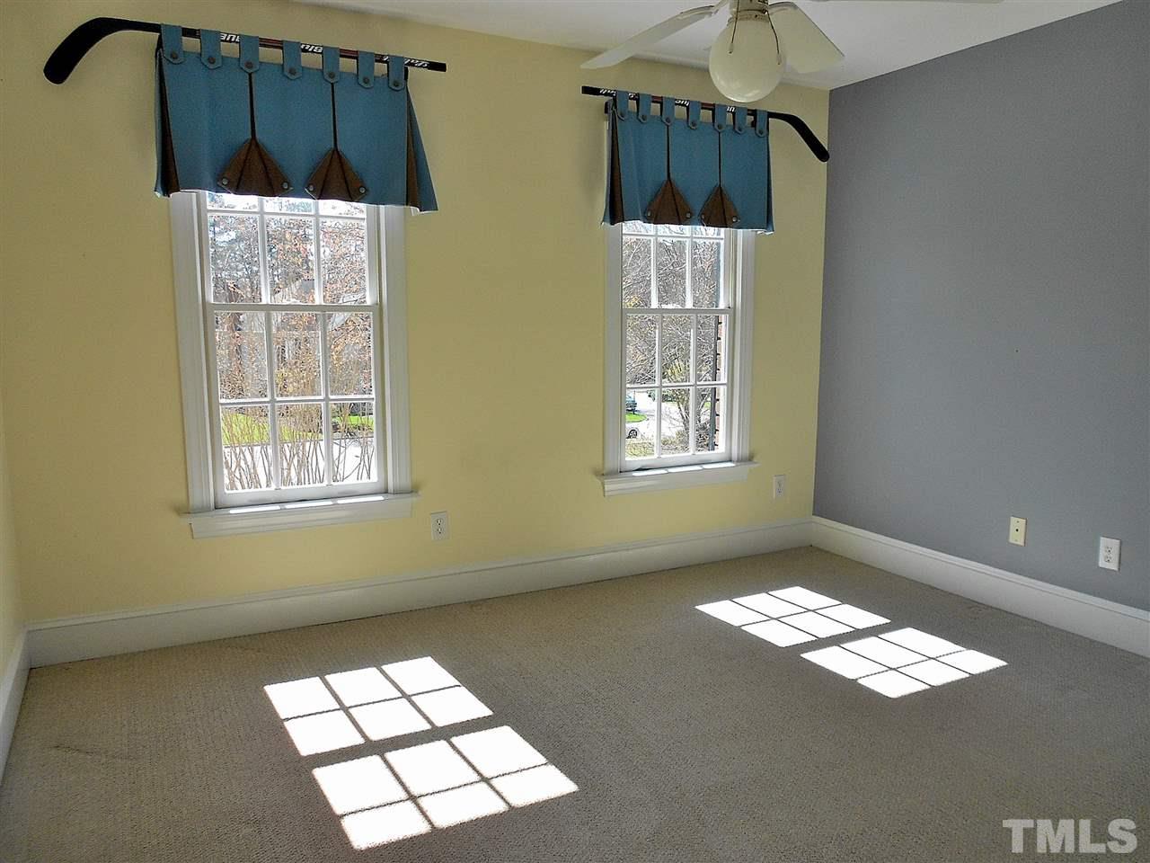 8704 Aldersgate Way Raleigh, NC 27615 - Photo 13 of 25 a view of an empty room with a window