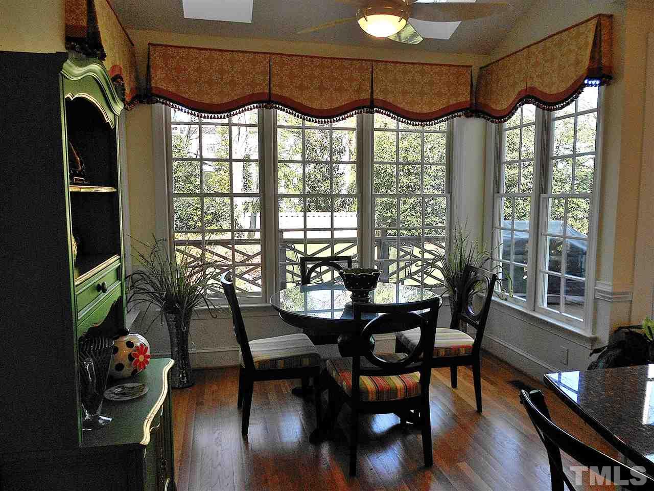 8704 Aldersgate Way Raleigh, NC 27615 - Photo 17 of 25 a view of a dining room with furniture window and outside view