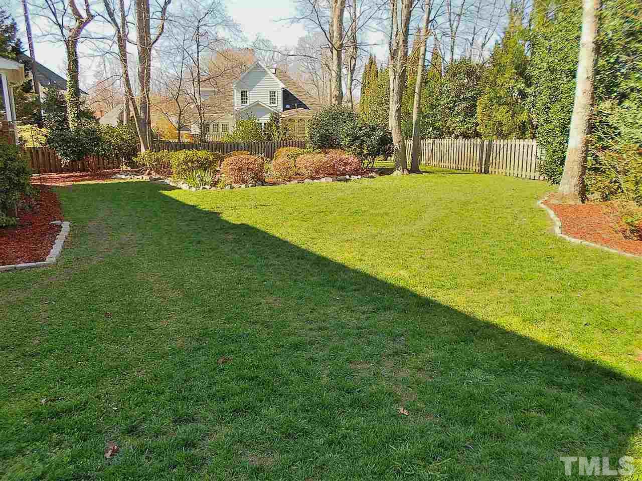8704 Aldersgate Way Raleigh, NC 27615 - Photo 21 of 25 a view of a field with a big yard