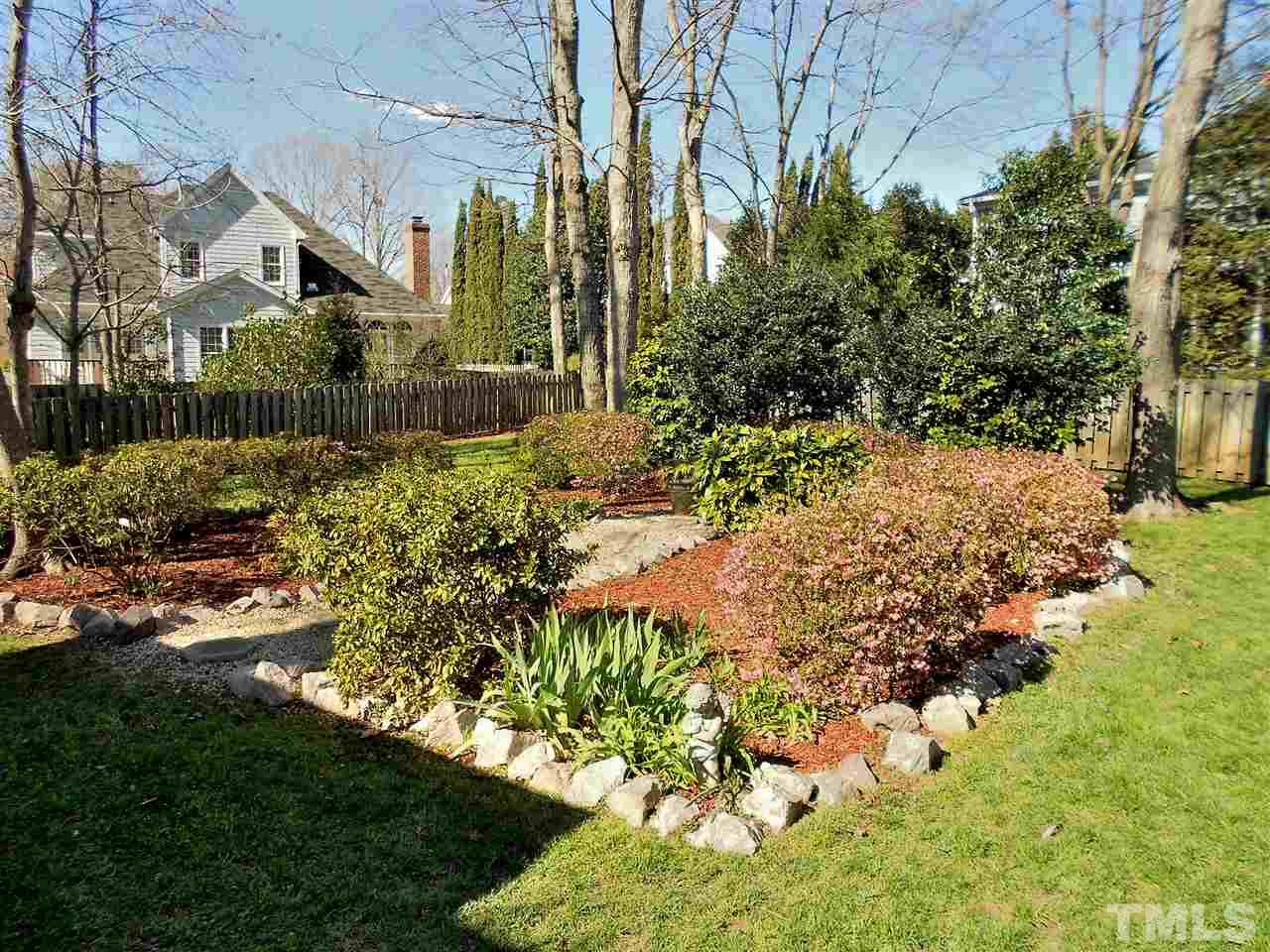 8704 Aldersgate Way Raleigh, NC 27615 - Photo 22 of 25 a view of a garden with plants