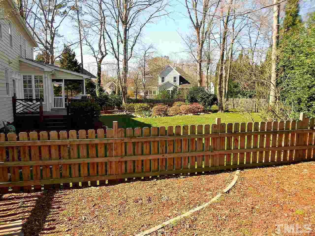 8704 Aldersgate Way Raleigh, NC 27615 - Photo 23 of 25 a view of a house with a wooden fence
