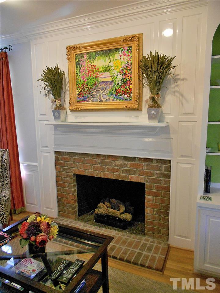 8704 Aldersgate Way Raleigh, NC 27615 - Photo 25 of 25 a living room with furniture and a fireplace