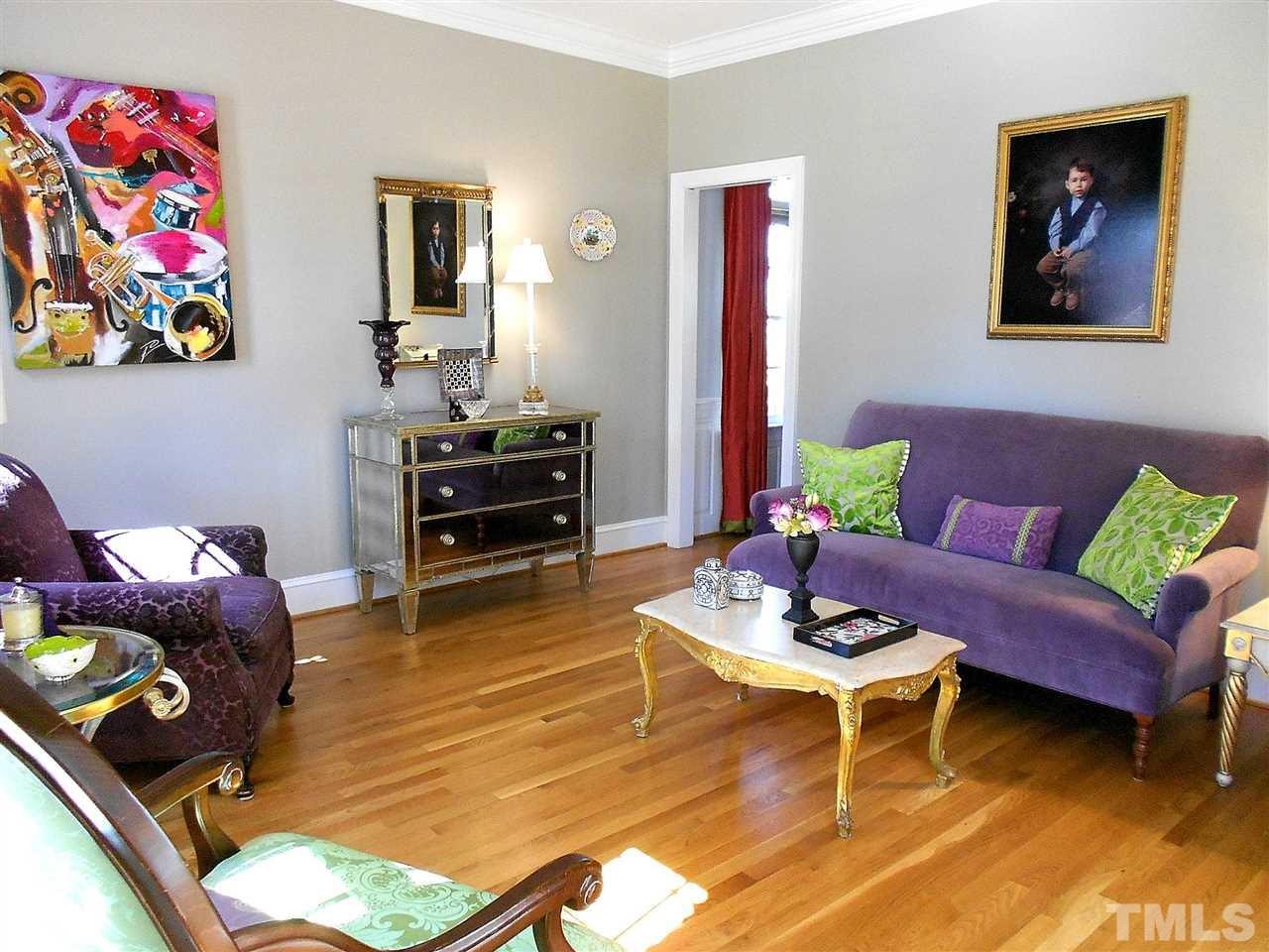 8704 Aldersgate Way Raleigh, NC 27615 - Photo 4 of 25 a living room with furniture and wooden floor