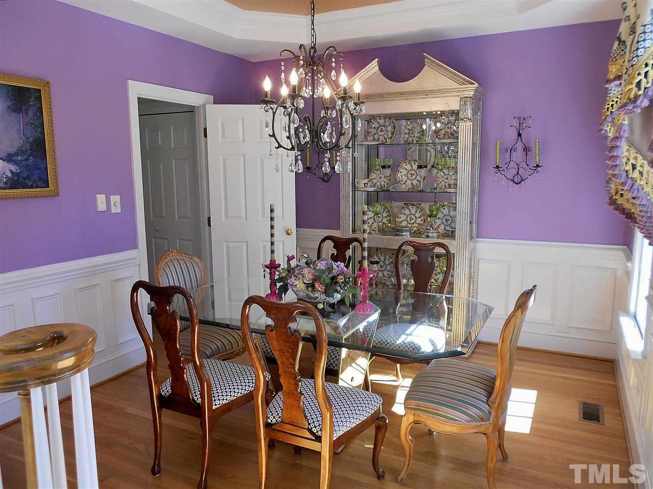 8704 Aldersgate Way Raleigh, NC 27615 - Photo 5 of 25 a view of a dining room with furniture and chandelier