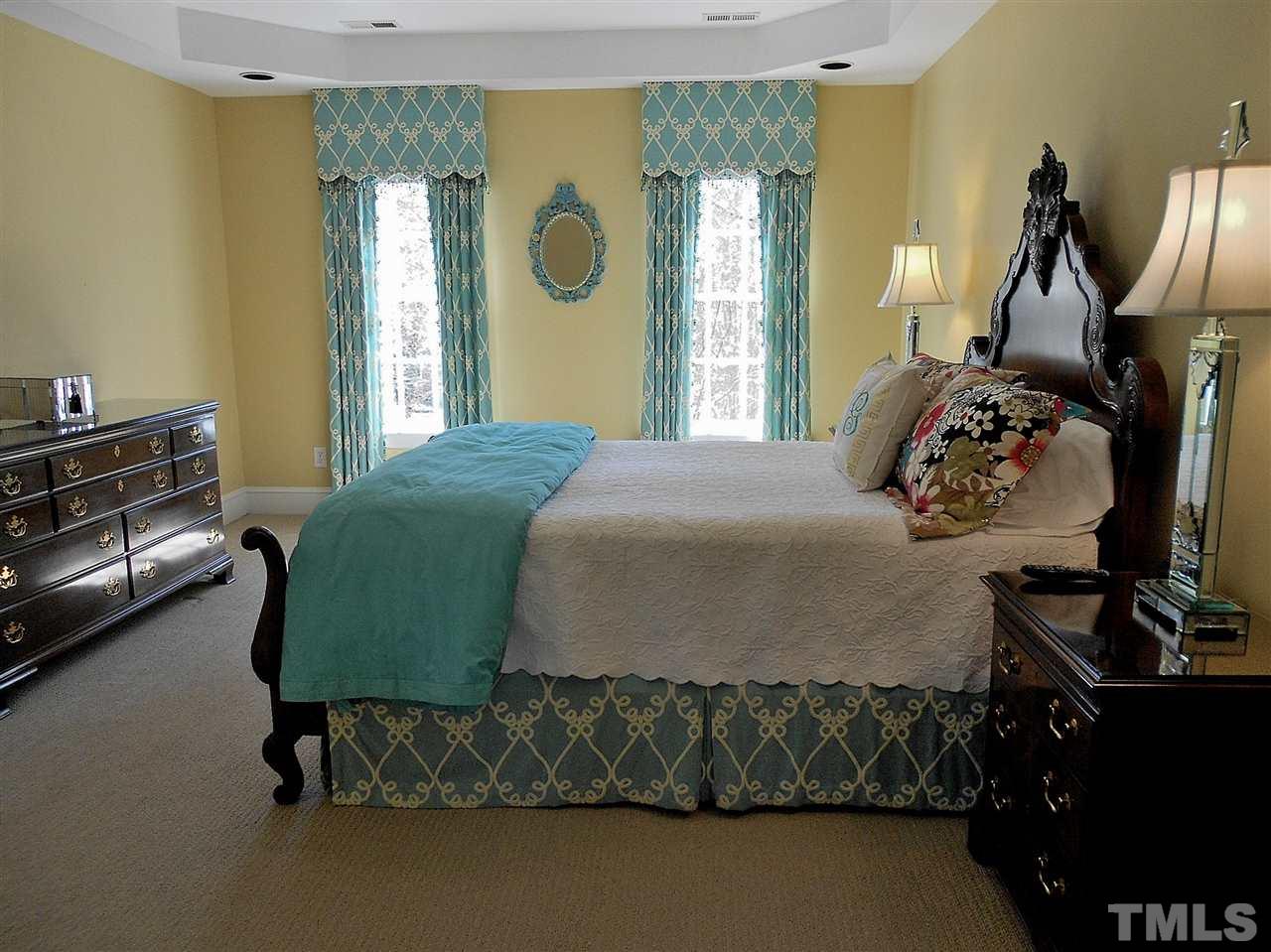 8704 Aldersgate Way Raleigh, NC 27615 - Photo 7 of 25 a bedroom with a bed and window