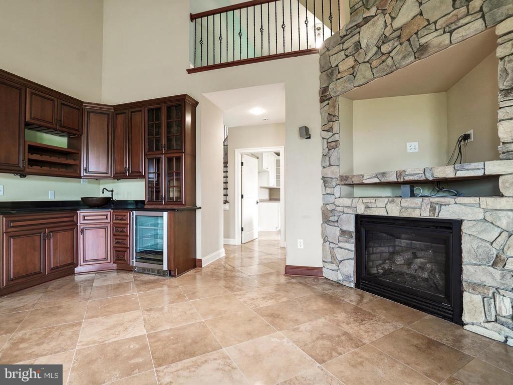 2131 Dixon Road Frederick, MD 21704 - Photo 11 of 65 Wet bar and dramatic fireplace
