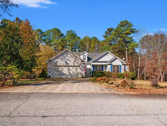 a wooden bench sitting in front of a house