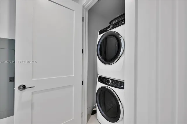 a bathroom with a double vanity sink mirror and shower