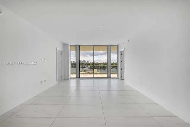 a kitchen with stainless steel appliances granite countertop a sink and a stove