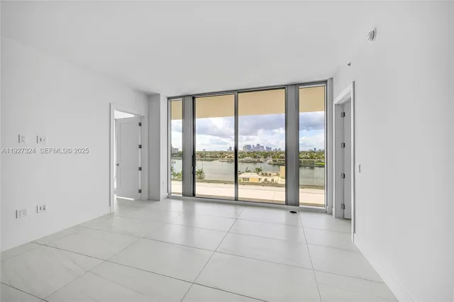 a row of lawn chairs under an umbrella