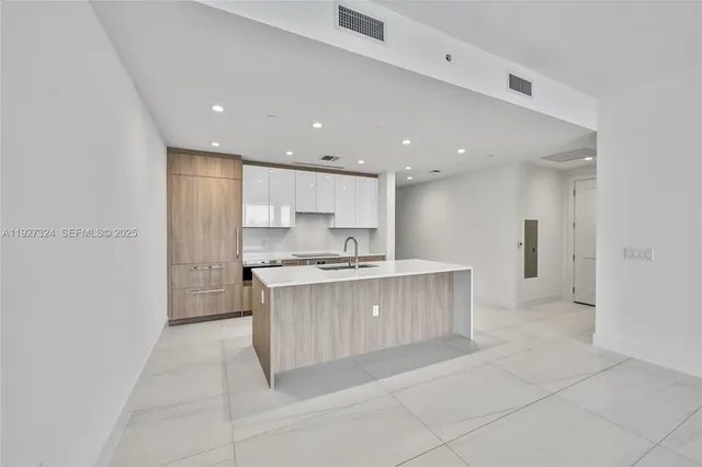 a view of a dining room with furniture wooden floor and chandelier