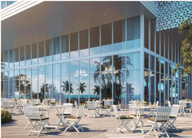 a living room with a table and a large window