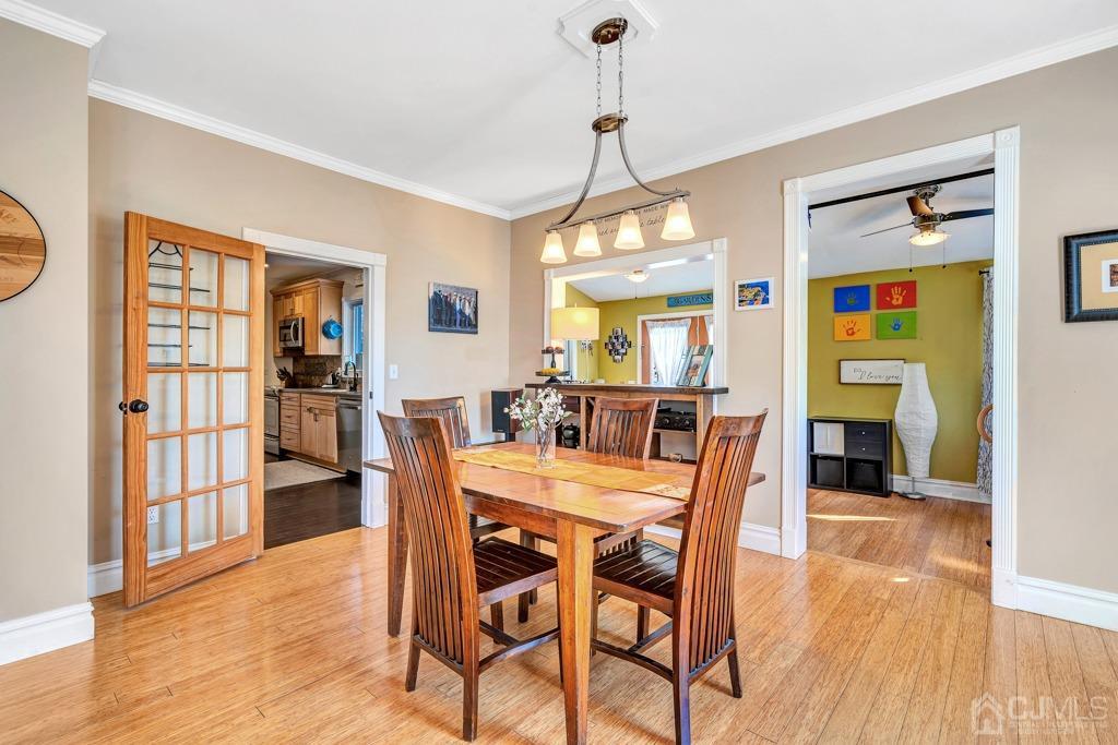 387 Prospect Avenue Dunellen, NJ 08812 - Photo 11 of 34 a view of a dining room with furniture window and wooden floor