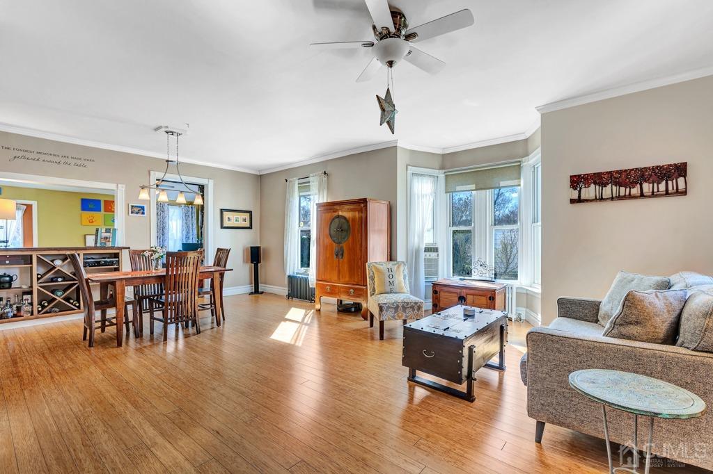 387 Prospect Avenue Dunellen, NJ 08812 - Photo 14 of 34 a living room with furniture and wooden floor