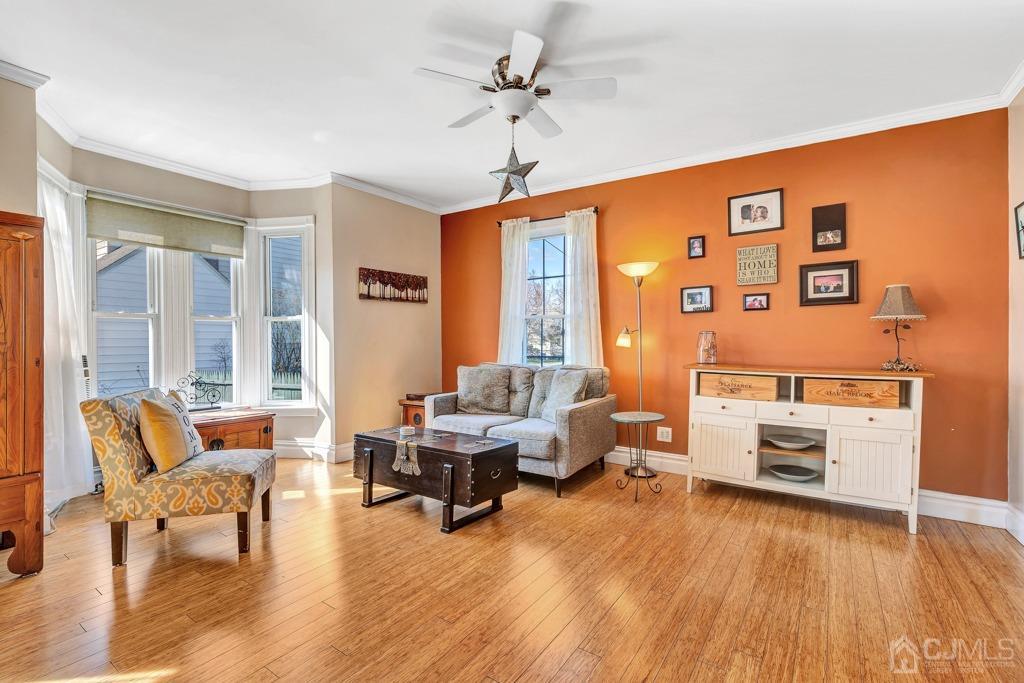 387 Prospect Avenue Dunellen, NJ 08812 - Photo 15 of 34 a living room with furniture and a wooden floor