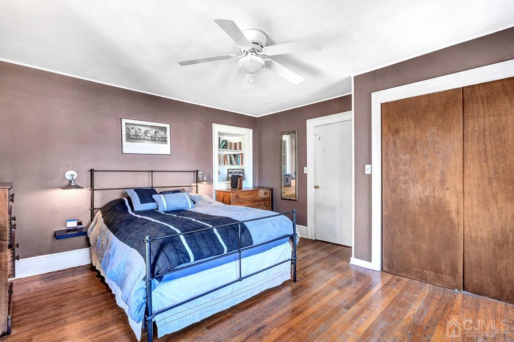 387 Prospect Avenue Dunellen, NJ 08812 - Photo 19 of 34 a bedroom with a bed and a ceiling fan