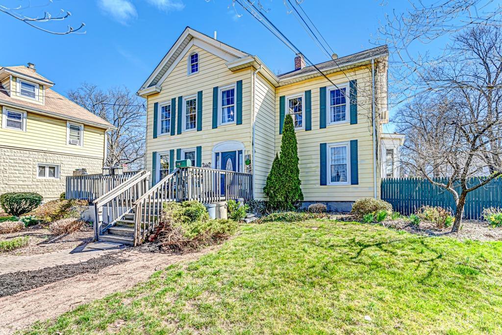 387 Prospect Avenue Dunellen, NJ 08812 - Photo 2 of 34 a front view of a house with a yard
