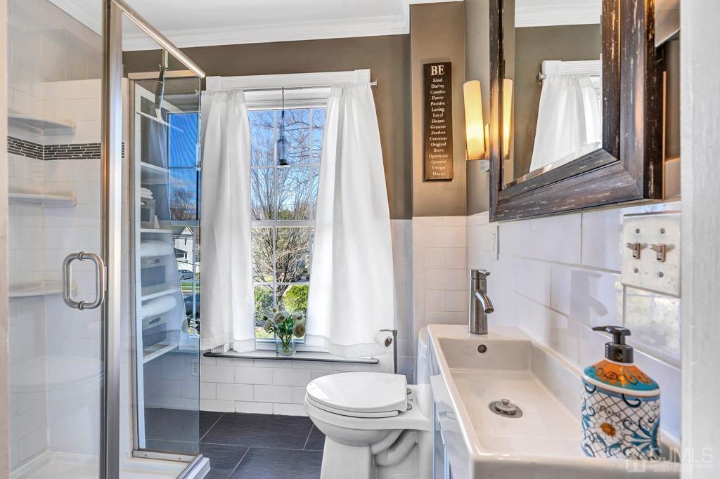 387 Prospect Avenue Dunellen, NJ 08812 - Photo 23 of 34 a bathroom with a sink toilet and shower
