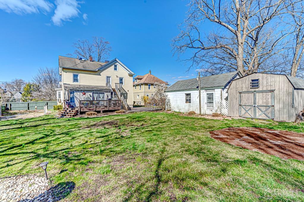 387 Prospect Avenue Dunellen, NJ 08812 - Photo 30 of 34 a front view of a house with a big yard