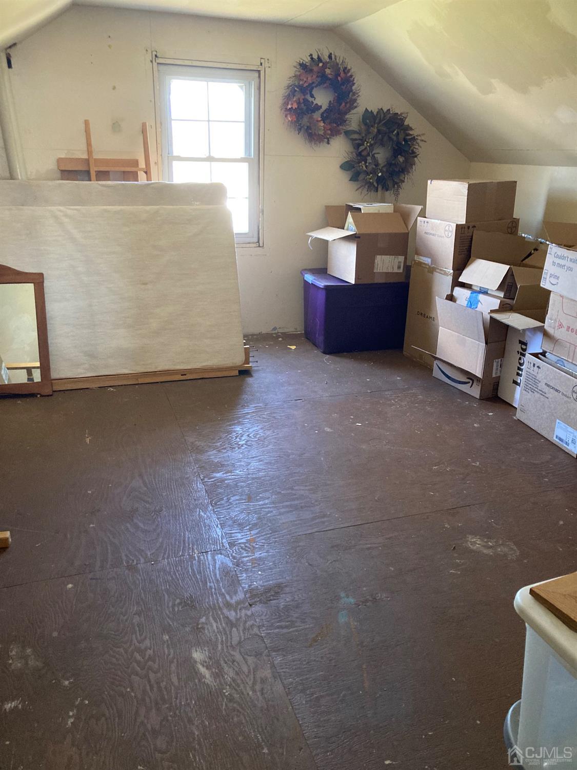 387 Prospect Avenue Dunellen, NJ 08812 - Photo 33 of 34 a bed room with a bed and a couch