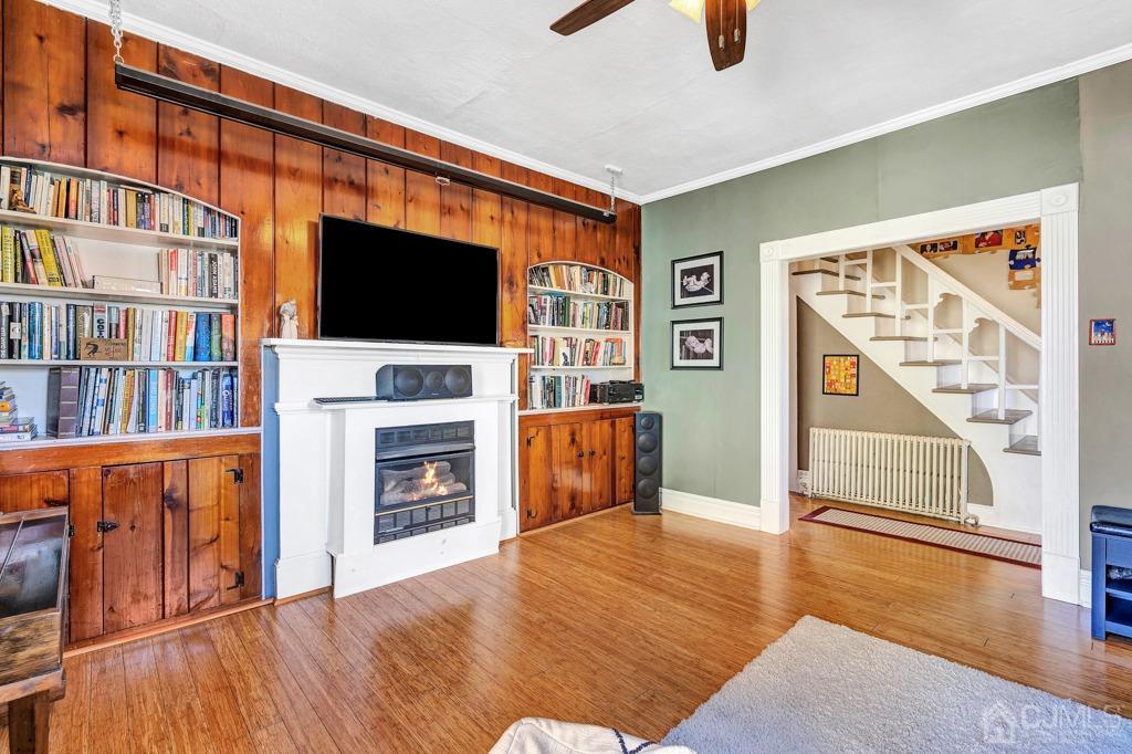 387 Prospect Avenue Dunellen, NJ 08812 - Photo 5 of 34 a living room with furniture and a flat screen tv