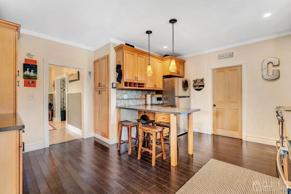387 Prospect Avenue Dunellen, NJ 08812 - Photo 9 of 34 a view of a kitchen with furniture and wooden floor