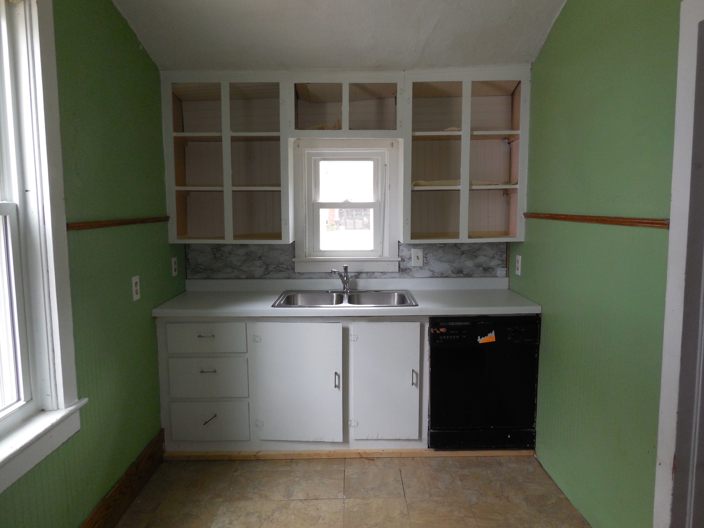 302 East Park Street Morrison, IL 61270 - Photo 2 of 15 a kitchen with a sink and a window