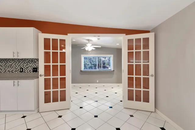 a view of empty room with windows