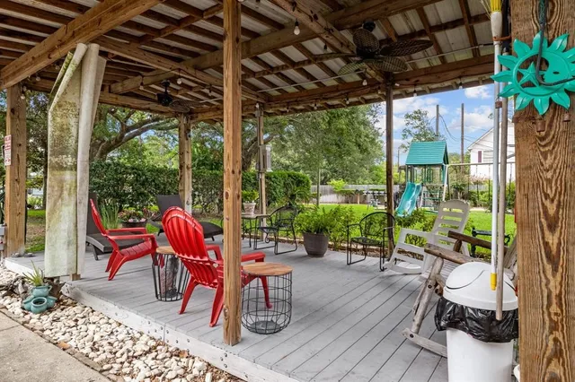 a patio with yard glass top table and chairs