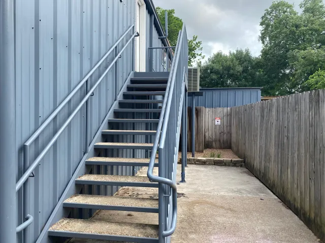 a view of entryway with wooden floor and stairs