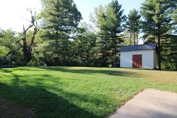 a backyard of a house with lots of green space