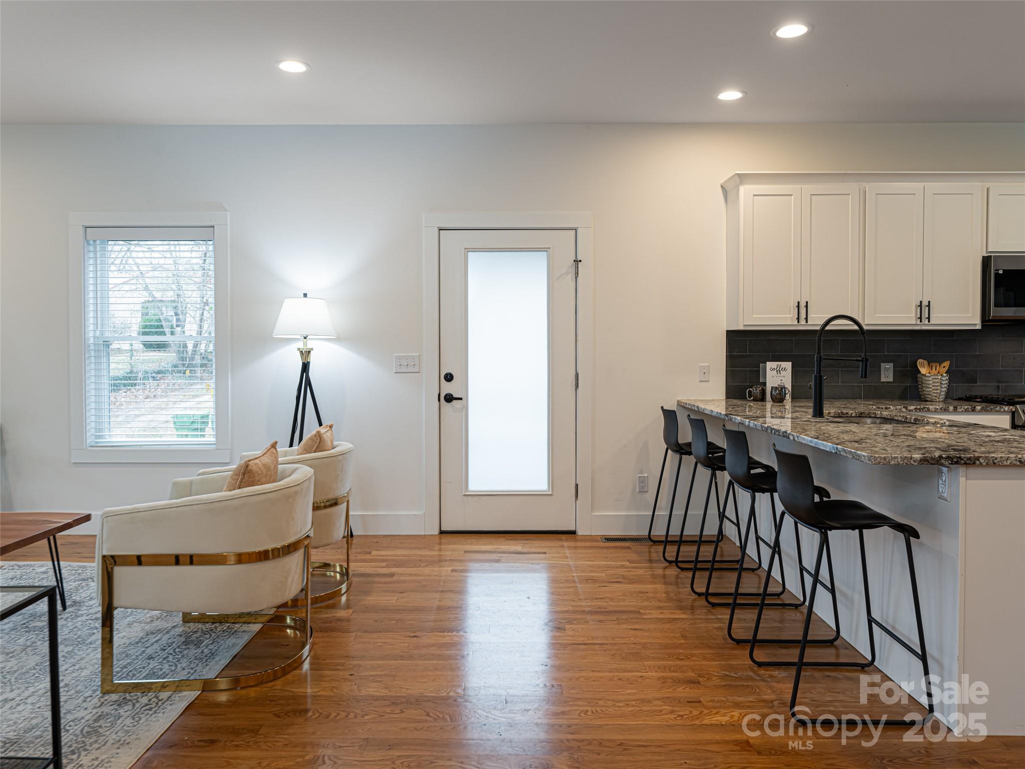 197 Chatham Road Asheville, NC 28804 - Photo 11 of 46 a dining room with furniture and wooden floor