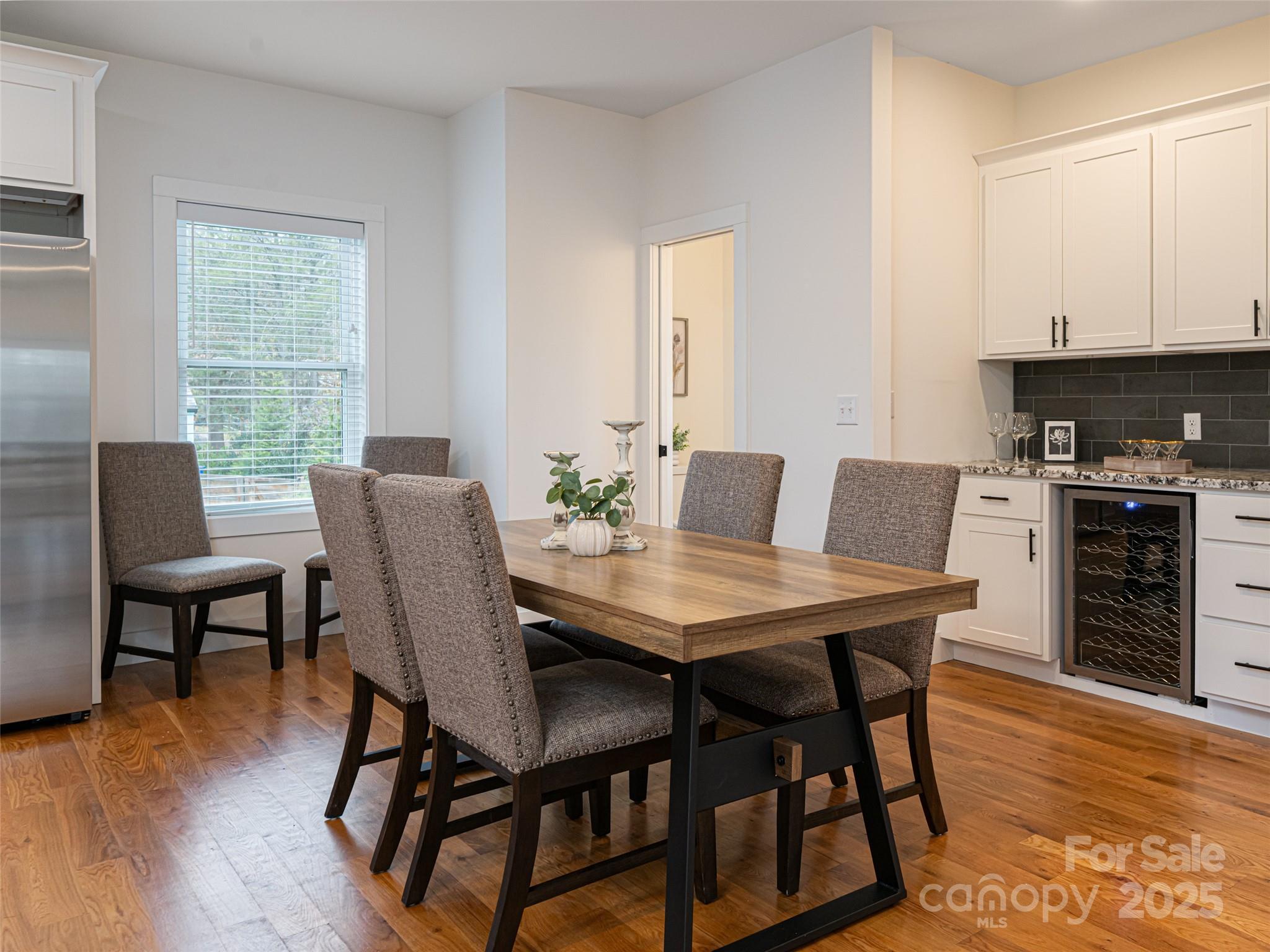 197 Chatham Road Asheville, NC 28804 - Photo 21 of 46 a view of a dining room with furniture and wooden floor